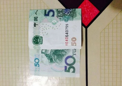 用钱折纸520爱心的折法步骤图解(520爱心怎么折纸)